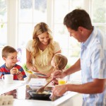 Father Preparing Family Breakfast In Kitchen